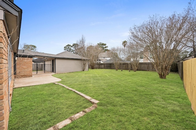 view of yard featuring a fenced backyard and a patio