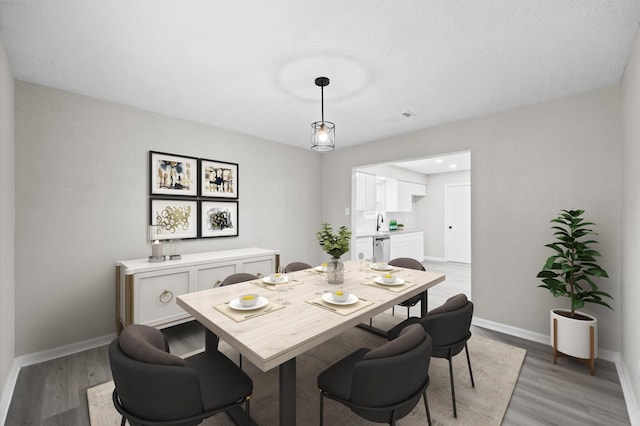 3610 Mossville Ct, Houston, TX 77068 - dining area with baseboards and light wood-type flooring