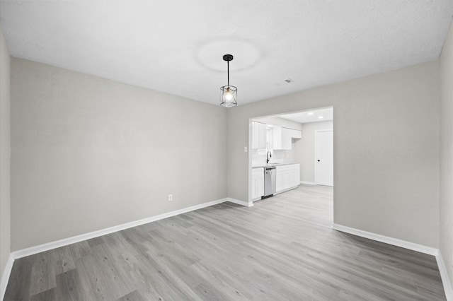 3610 Mossville Ct, Houston, TX 77068 - unfurnished living room featuring baseboards and light wood-style floors