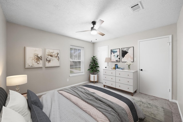 3610 Mossville Ct, Houston, TX 77068 - bedroom featuring light colored carpet, a textured ceiling, baseboards, and a ceiling fan