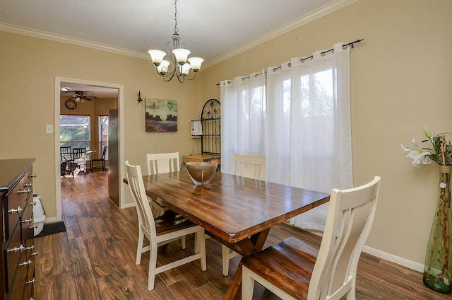 dining space with a notable chandelier, crown molding, baseboards, and dark wood-type flooring