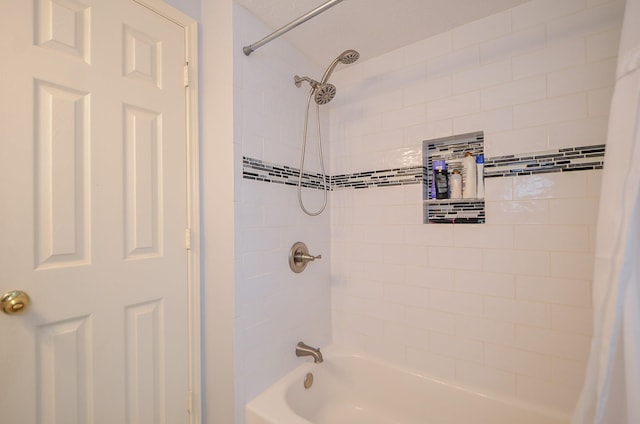 bathroom with shower / bath combo with shower curtain