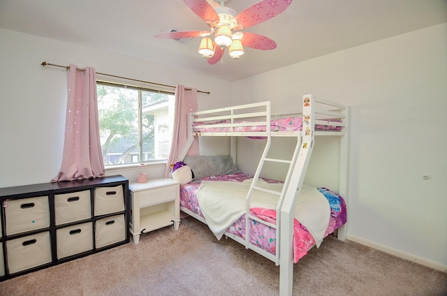 bedroom with baseboards, a ceiling fan, and light colored carpet