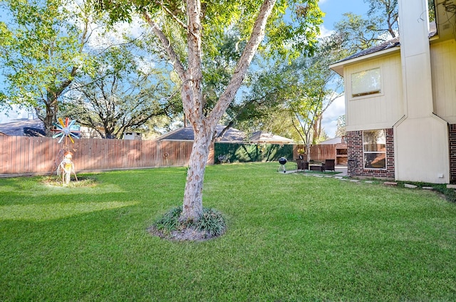 view of yard with a fenced backyard