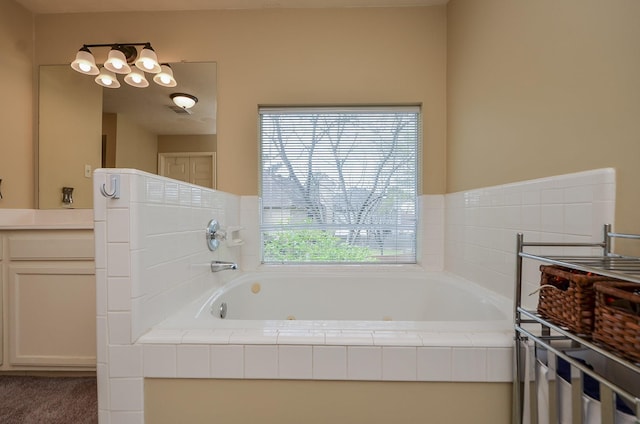 bathroom featuring visible vents and a bath