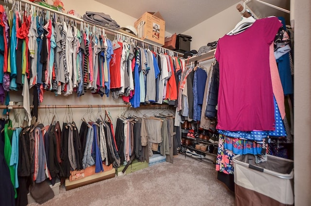 spacious closet with carpet flooring