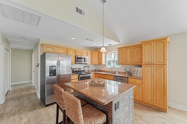 kitchen with visible vents, light brown cabinets, appliances with stainless steel finishes, and a sink