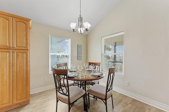 dining space featuring a notable chandelier, light wood finished floors, and a healthy amount of sunlight