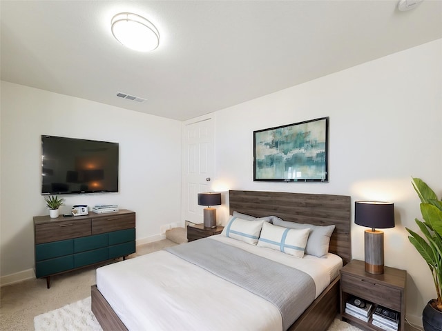 bedroom featuring carpet, visible vents, and baseboards