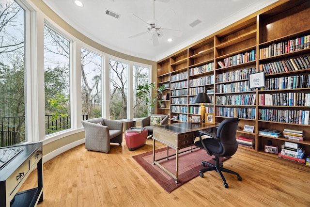 office area with recessed lighting, a healthy amount of sunlight, visible vents, and light wood-style flooring