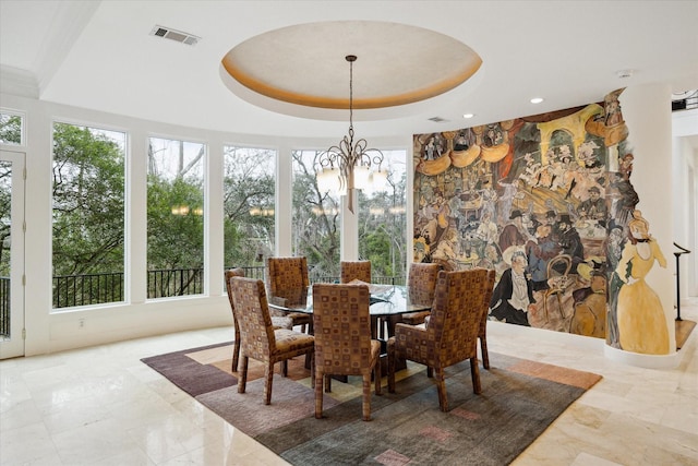 dining room featuring marble finish floor, a tray ceiling, visible vents, and a notable chandelier