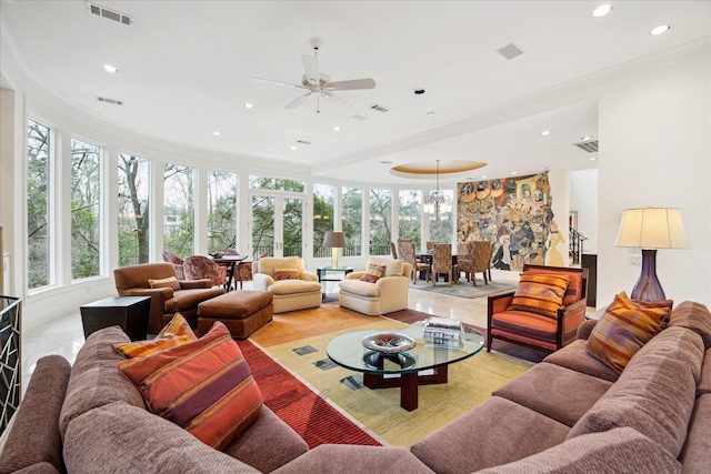 living area featuring visible vents and recessed lighting