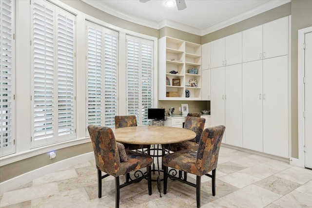 dining area featuring ornamental molding, a ceiling fan, and baseboards