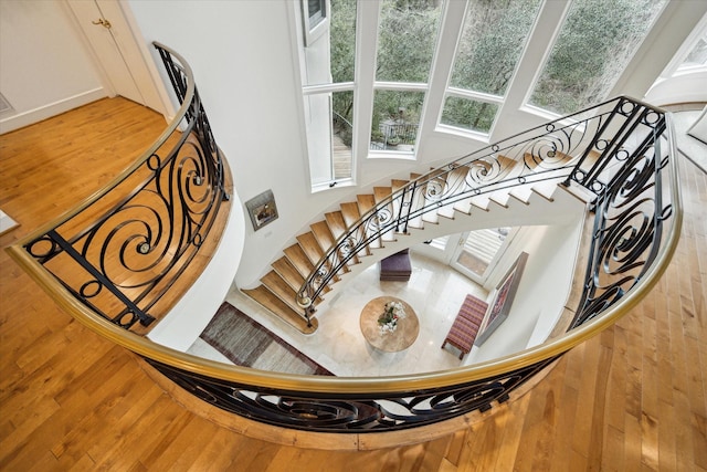 staircase with wood finished floors