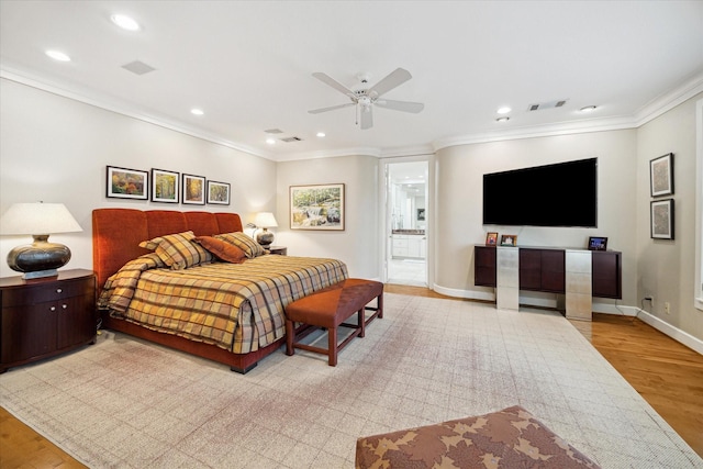 bedroom featuring recessed lighting, visible vents, baseboards, light wood-style floors, and crown molding