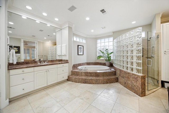 full bathroom featuring a stall shower, visible vents, ornamental molding, and vanity