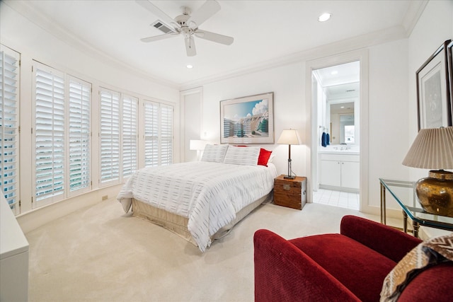 bedroom with visible vents, light colored carpet, ensuite bath, crown molding, and recessed lighting