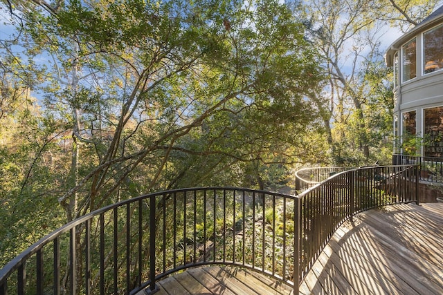 wooden terrace featuring a gate