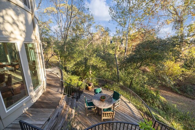 deck with outdoor dining area