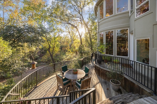 wooden deck with outdoor dining area