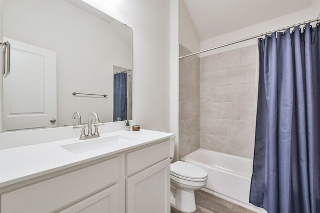 bathroom featuring vanity, wood finished floors, shower / bath combo with shower curtain, and toilet