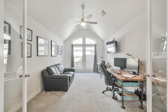 home office with visible vents, a ceiling fan, lofted ceiling, carpet flooring, and french doors