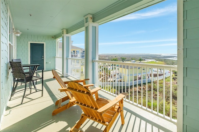 balcony featuring a water view