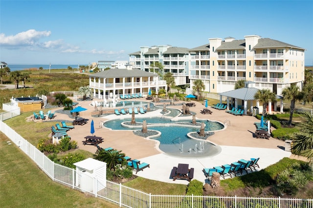 community pool featuring a gazebo, a patio area, and fence