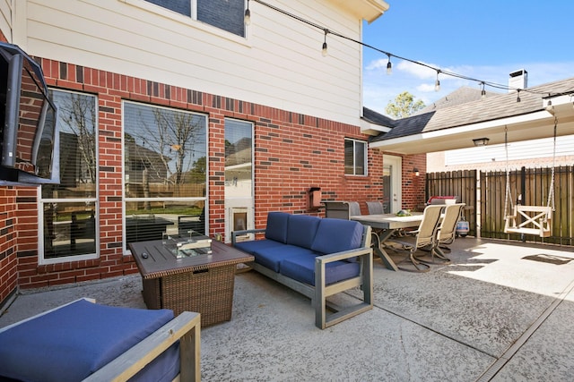 view of patio / terrace with outdoor dining space, fence, and an outdoor living space