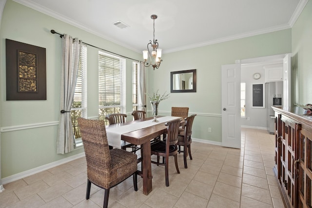 dining room with light tile patterned floors, visible vents, baseboards, an inviting chandelier, and crown molding