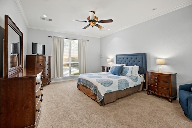 bedroom with carpet floors, ornamental molding, visible vents, and a ceiling fan