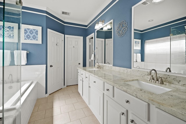 full bath with crown molding, tiled bath, visible vents, and a sink