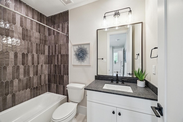 bathroom with visible vents, toilet, vanity, and bathing tub / shower combination