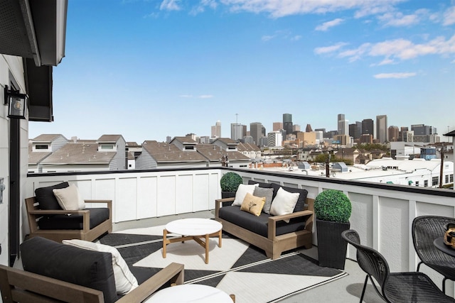 balcony with a city view and outdoor lounge area