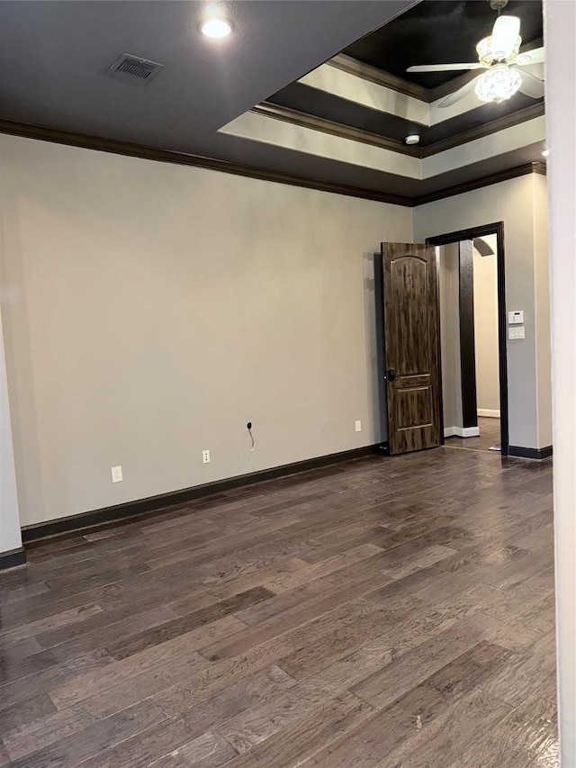 18931 Winding Atwood Ln, Tomball, TX 77377 - spare room featuring ornamental molding, a raised ceiling, visible vents, and dark wood-style floors