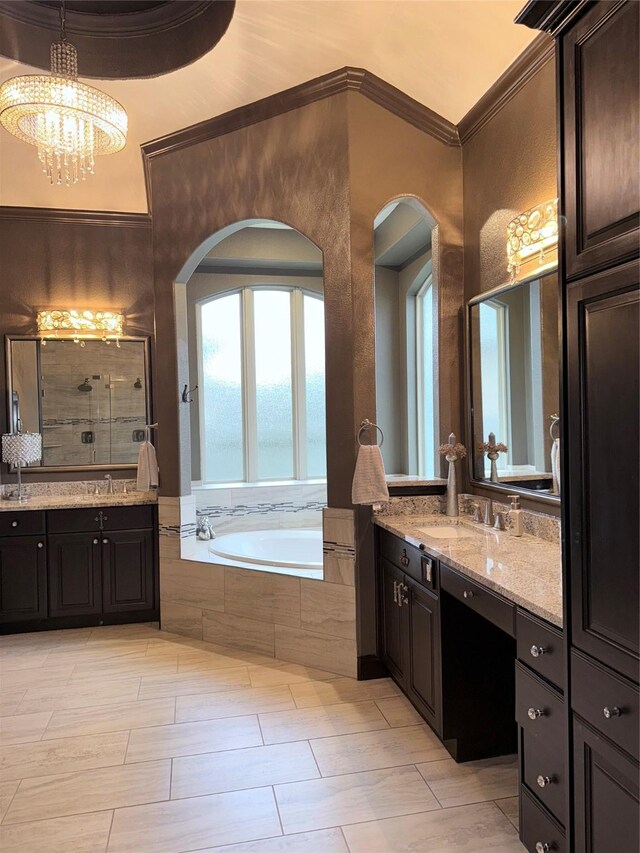 18931 Winding Atwood Ln, Tomball, TX 77377 - bathroom with an inviting chandelier, a tile shower, crown molding, vanity, and a bath