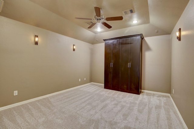 18931 Winding Atwood Ln, Tomball, TX 77377 - unfurnished bedroom with lofted ceiling, visible vents, light carpet, and baseboards