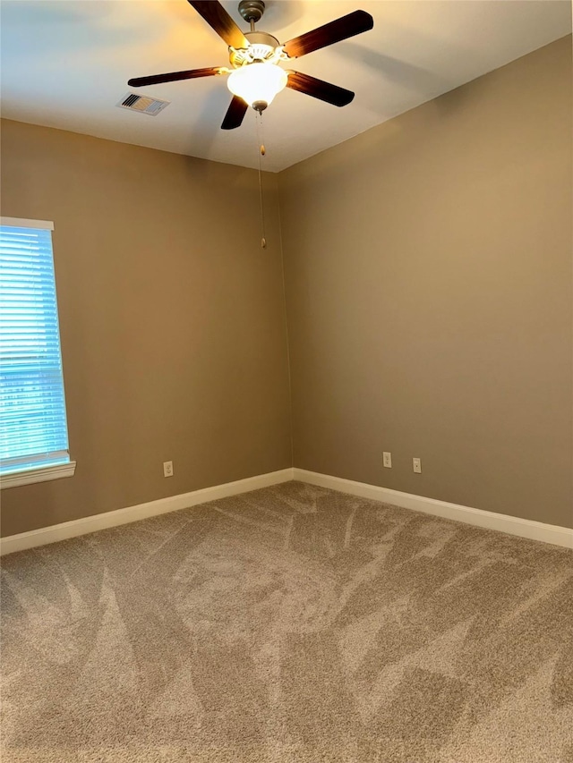 18931 Winding Atwood Ln, Tomball, TX 77377 - empty room featuring carpet, visible vents, ceiling fan, and baseboards