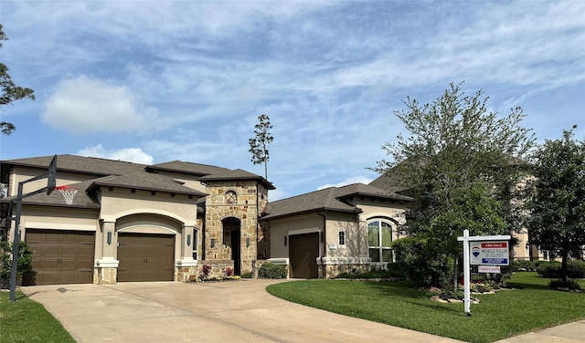 view of front facade with stucco siding, concrete driveway, an attached garage, stone siding, and a front lawn