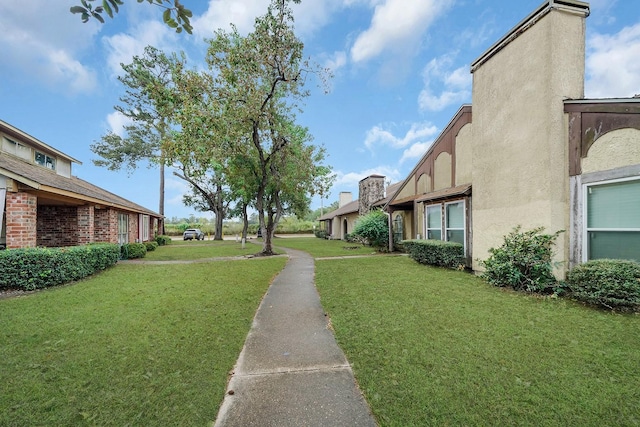 surrounding community featuring a lawn