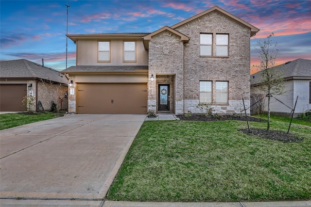 traditional home with a garage, concrete driveway, stone siding, and a front yard