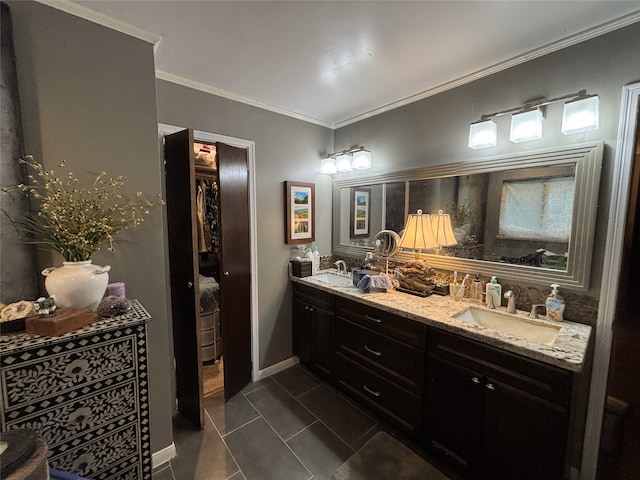 bathroom with double vanity, a sink, and crown molding