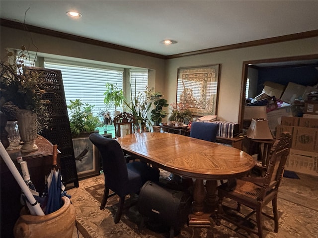 dining space featuring recessed lighting and crown molding