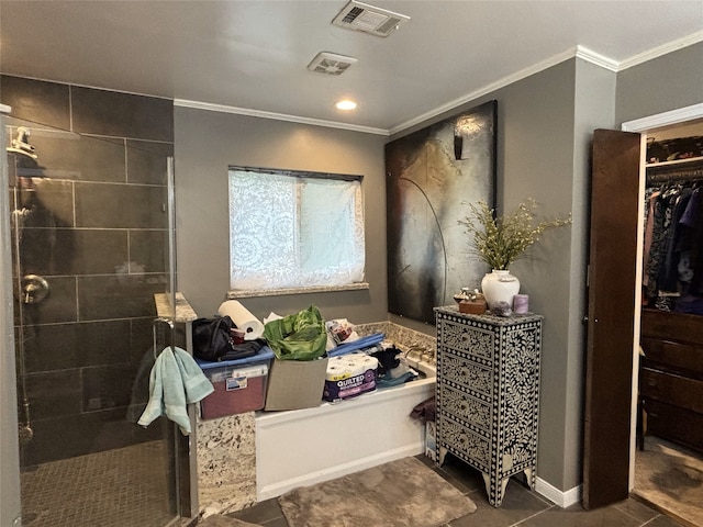 bathroom with tiled shower, ornamental molding, visible vents, and tile patterned flooring