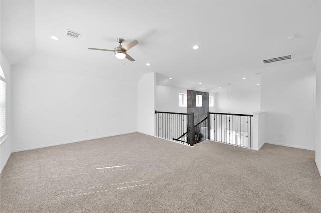 spare room with a ceiling fan, recessed lighting, visible vents, and carpet flooring