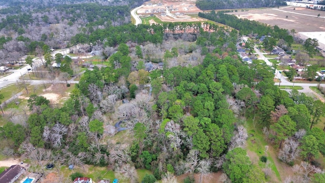 drone / aerial view featuring a forest view