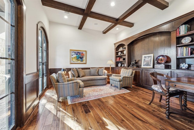 living area featuring recessed lighting, wainscoting, coffered ceiling, beamed ceiling, and hardwood / wood-style flooring