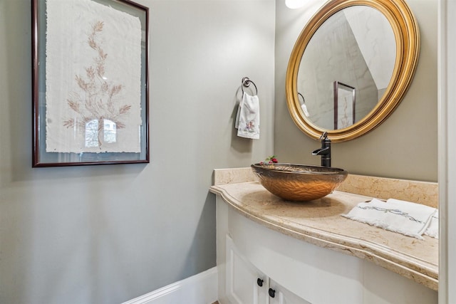 bathroom featuring vanity and baseboards