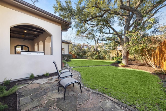 view of yard with a patio and a fenced backyard