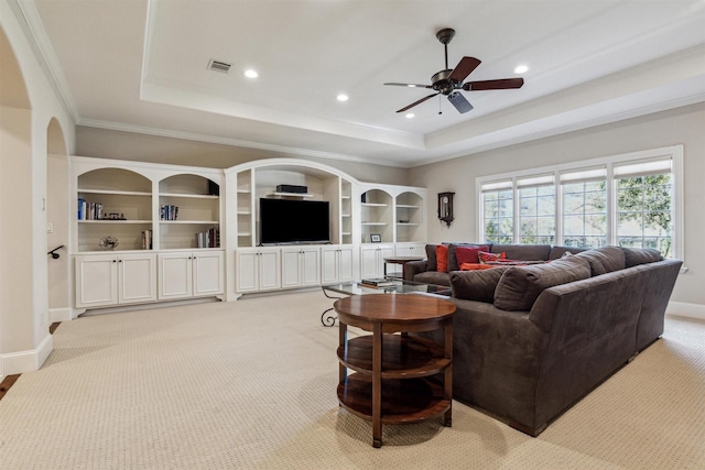 living area featuring visible vents, a tray ceiling, baseboards, and recessed lighting